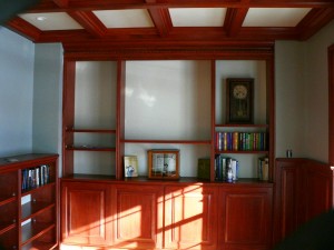 The African Mahogany main book case featured a enclosed bottom case and open display area